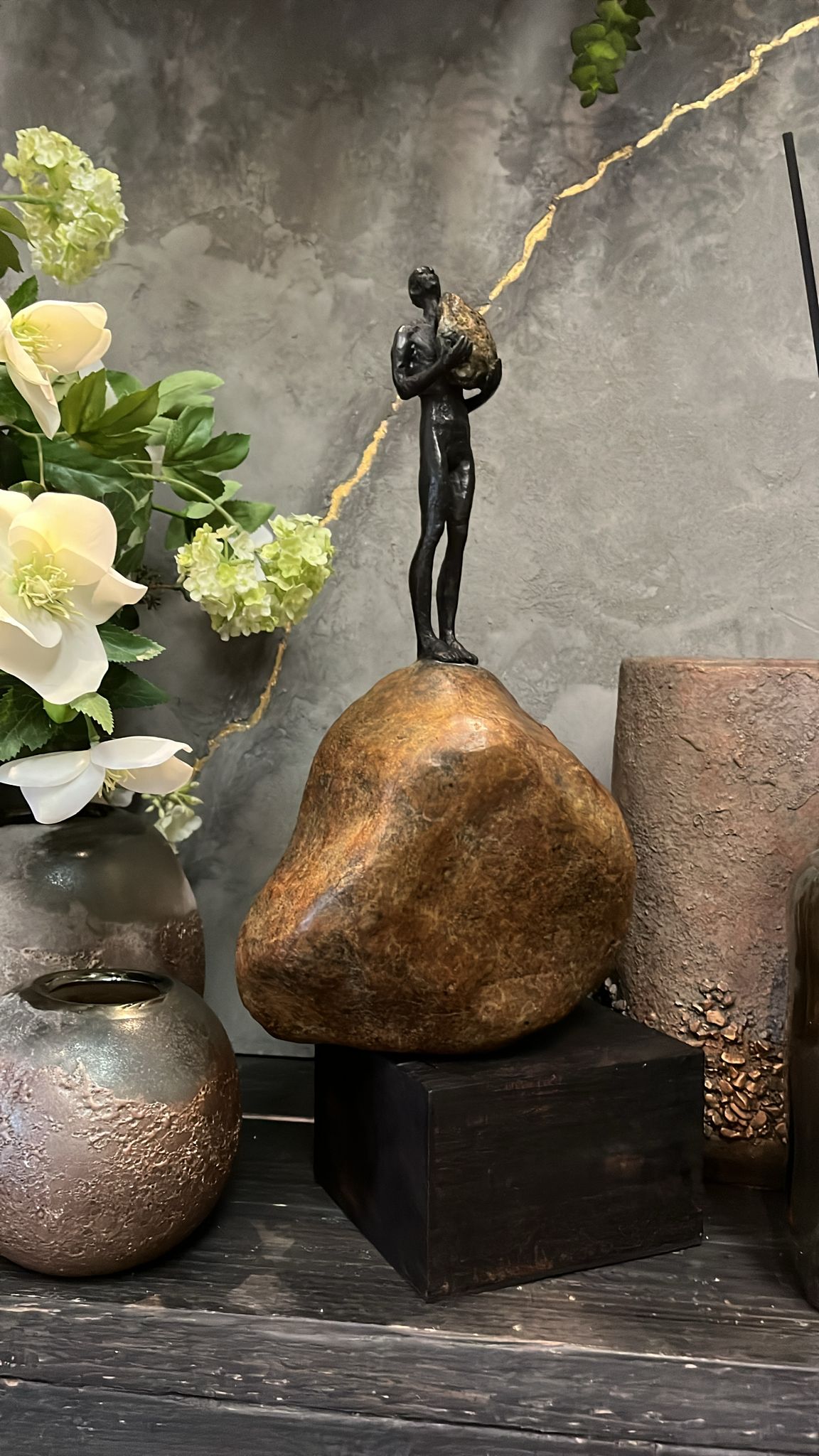 Bronze Figure On Rock High